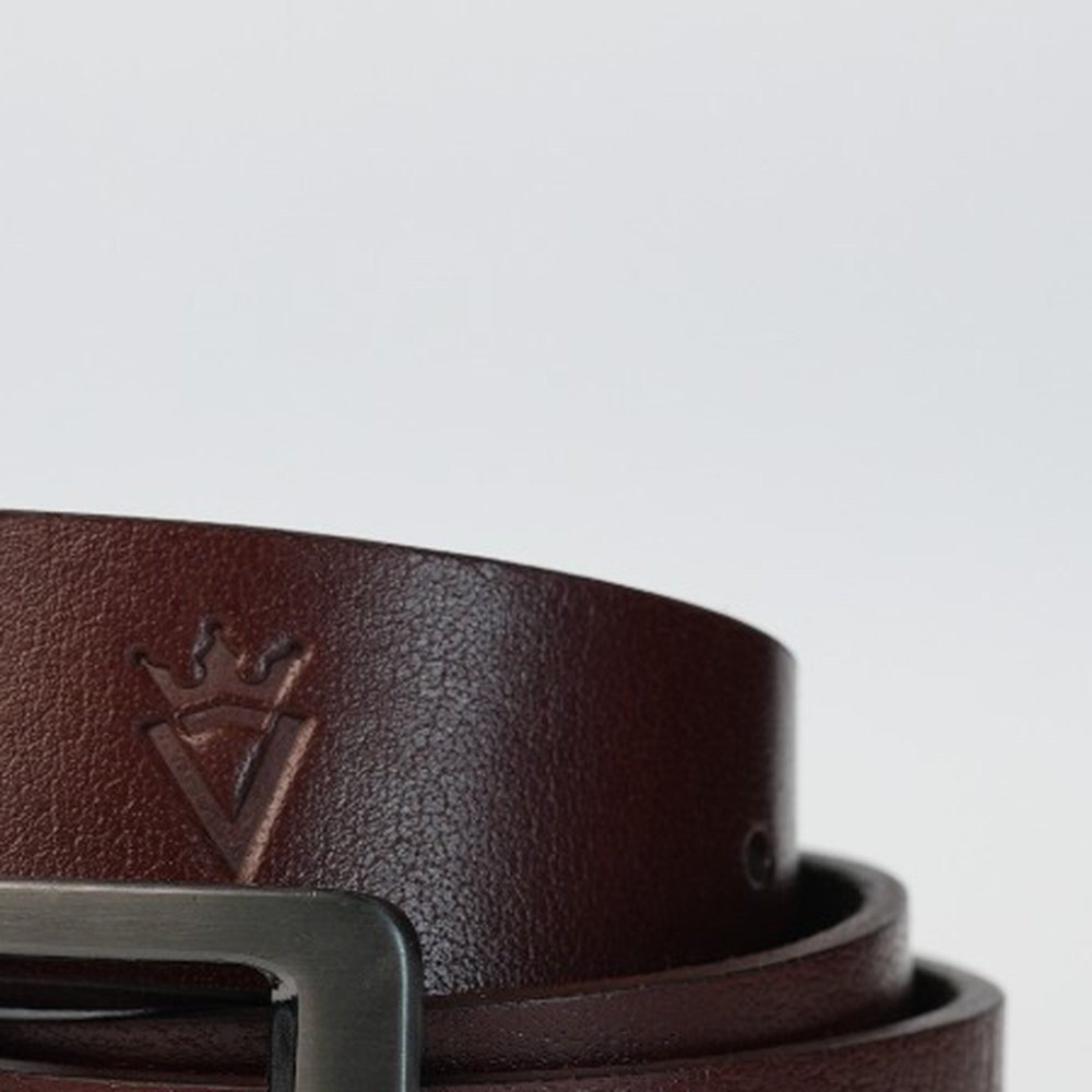The crowned V embossed into full-grain leather
